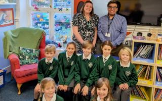 Amy Howe (headteacher) and Robert Stoner (deputy headteacher). with pupils from Corfe Castle  Primary School