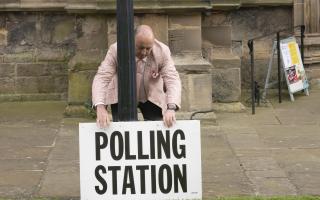 People can vote in person, by post or by sending someone in their place. (Danny Lawson/PA)