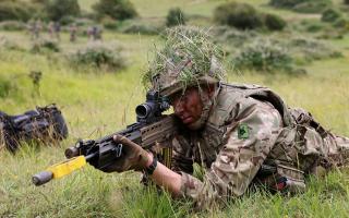 A soldier taking part in military training at Lulworth Ranges