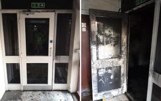 A fire door that has been exposed to a fire in a block of flats