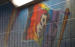 AFC Bournemouth badge in the mural on a rainbow flag before the vandalism.