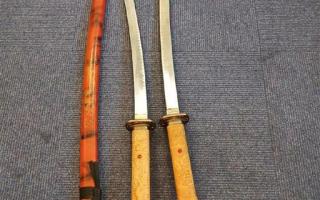 Two men arrested after police seize large samurai swords in West Howe