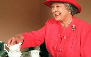 The Queen joined Mrs Susan McCarron for tea in her home in the Castlemilk area of Glasgow in 1999. Picture: PA