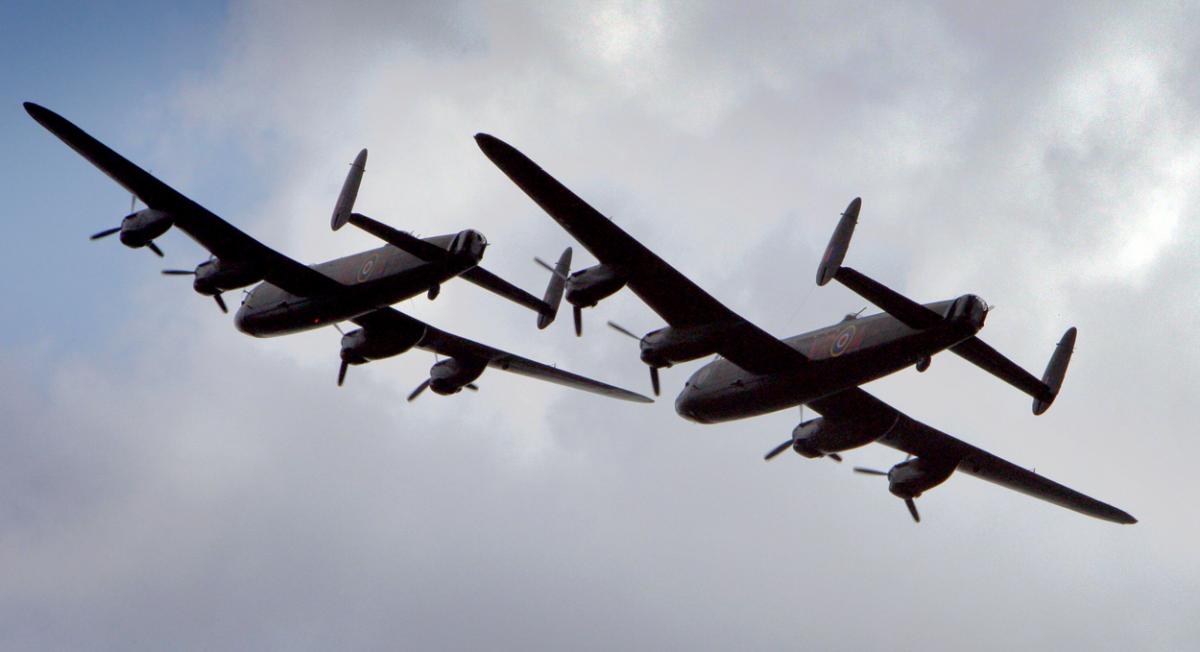 The world's two airworthy Lancasters fly in to Bournemouth Airport. Photos by Richard Crease. 