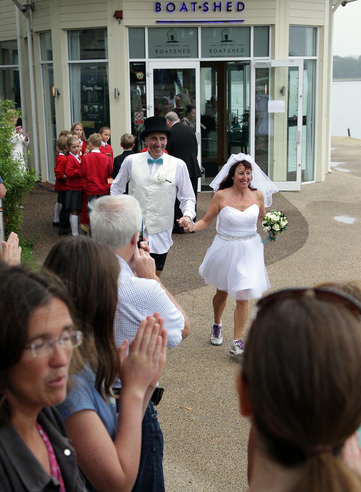 Keen runners Eve Carter and Graham Filmer tie the knot during the Poole parkrun. Photos by Sally Adams. 