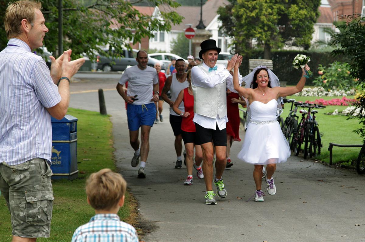 Keen runners Eve Carter and Graham Filmer tie the knot during the Poole parkrun. Photos by Sally Adams. 