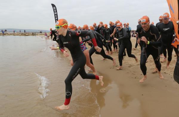 Swimmers taking part in the Poole Open Water swim  off  Sandbanks beach.