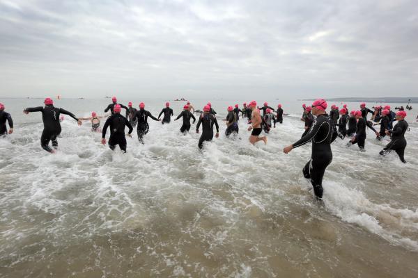 Swimmers taking part in the Poole Open Water swim  off  Sandbanks beach.