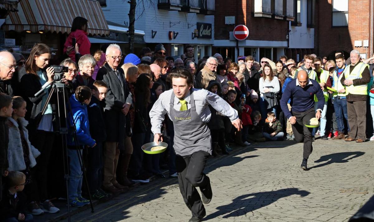 Pancake Day races take place in Christchurch on Shrove Tuesday. Pictures by Sally Adams.