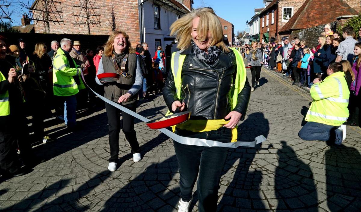 Pancake Day races take place in Christchurch on Shrove Tuesday. Pictures by Sally Adams.