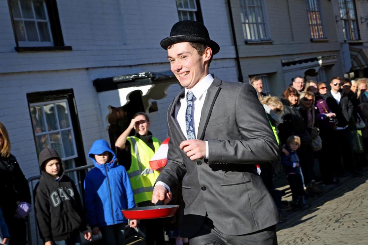 Pancake Day races take place in Christchurch on Shrove Tuesday. Pictures by Sally Adams.