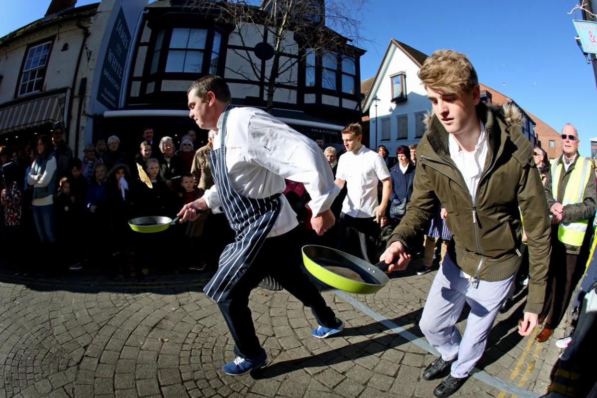 Pancake Day races take place in Christchurch on Shrove Tuesday. Pictures by Sally Adams.