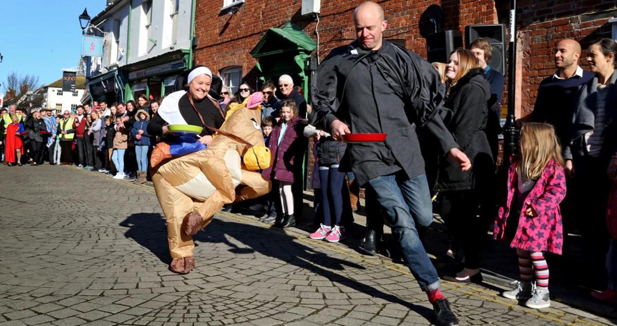 Pancake Day races take place in Christchurch on Shrove Tuesday. Pictures by Sally Adams.