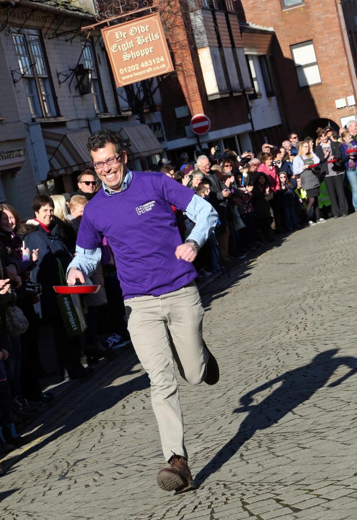 Pancake Day races take place in Christchurch on Shrove Tuesday. Pictures by Sally Adams.